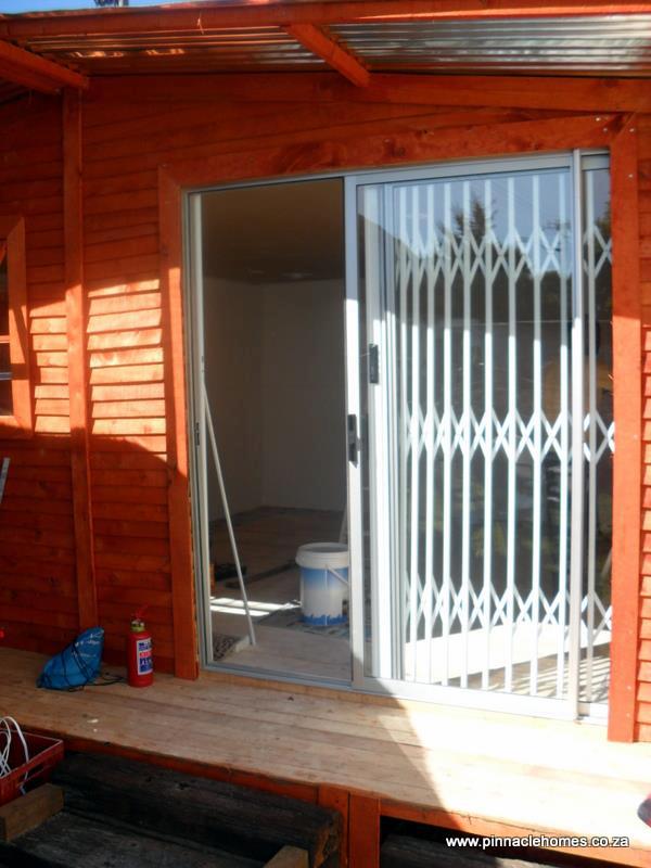 Wendy house with stoep, patio doors, and slam lock gate